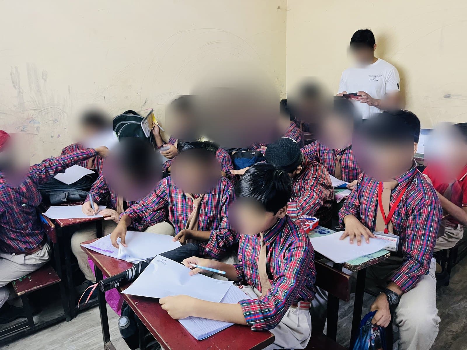 Students drawing at their desks during the Wildlife Rescue contest