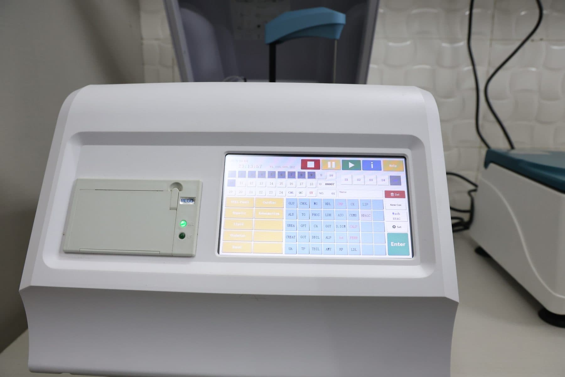 Automatic blood chemistry analyzer at Wildlife Rescue clinic — runs liver, kidney, and electrolyte panels on avian patients