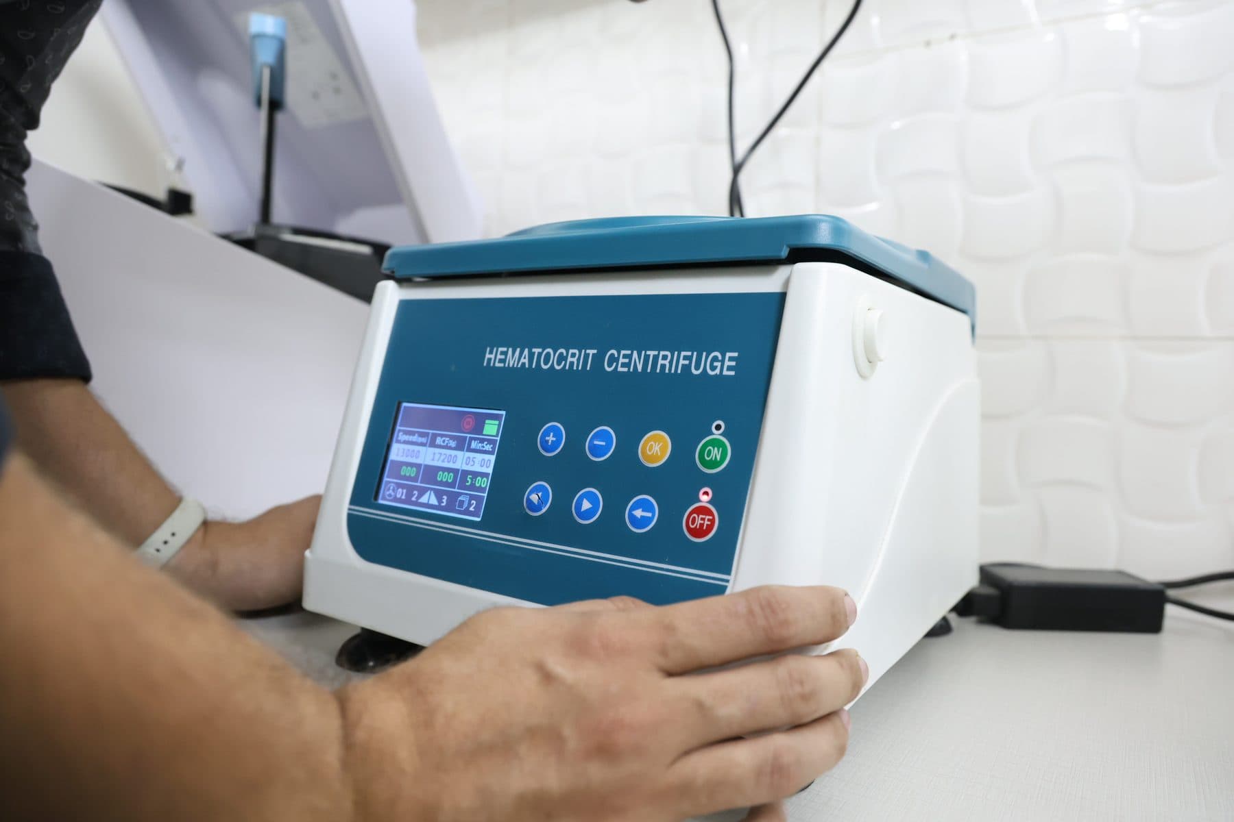 Centrifuge machine for blood work at Wildlife Rescue clinic — essential for avian hematology and diagnostics